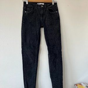Snake skin black skinny jeans